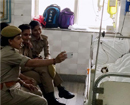 Cops take selfie with acid attack victim, suspended